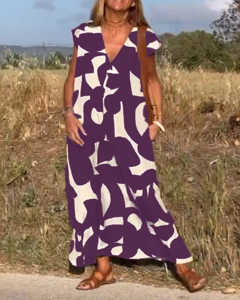 NINA – V-Ausschnitt Maxikleid mit Druck und Flügelärmeln