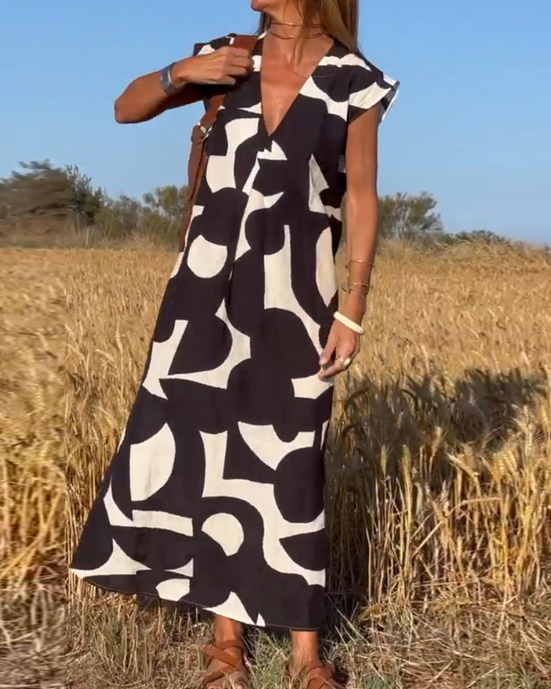 NINA – V-Ausschnitt Maxikleid mit Druck und Flügelärmeln