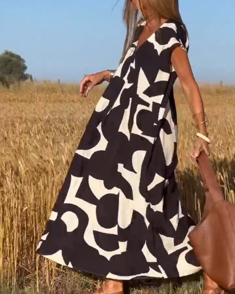 NINA – V-Ausschnitt Maxikleid mit Druck und Flügelärmeln