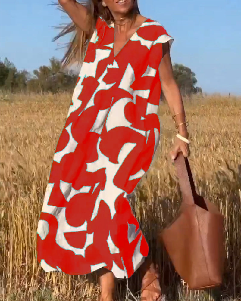NINA – V-Ausschnitt Maxikleid mit Druck und Flügelärmeln